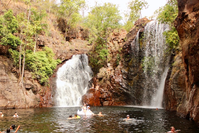 People swim in the Florence Falls plunge poole in Litchfield National Park