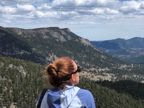 Woman looks at mountain in Colorado