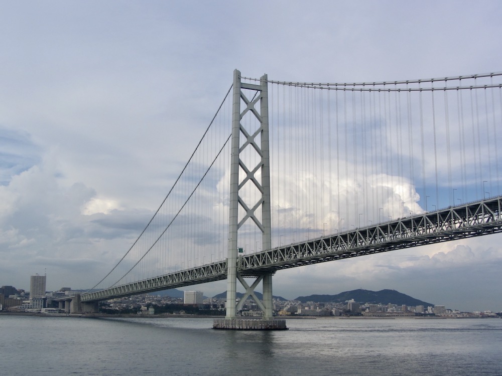 Akashi-Kaikyo bridge spans 4 kilometers from mainland Japan to Awaji Island. It is the world's largest suspension bridge.