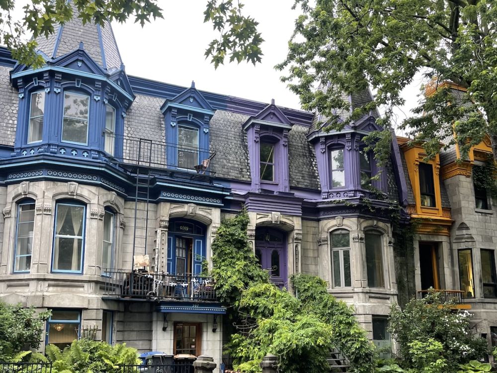 Blue, purple, and orange painted victorian buildings at Square St Louis in Montreal